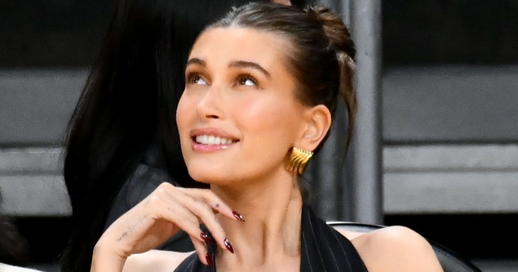 Hailey Bieber’s Thongkini and ’90s Bucket Hat Are as Relevant