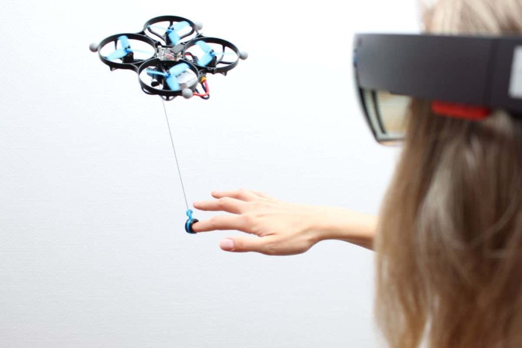 Drones on strings could puppeteer people in virtual reality