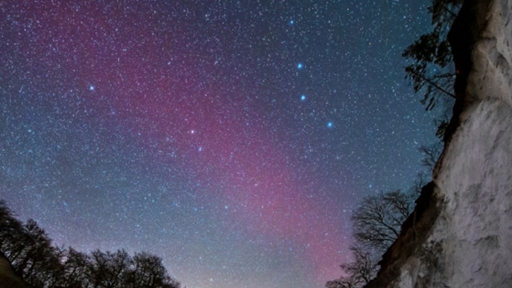 Rare blood-red arc of light shines in the Scandinavian sky