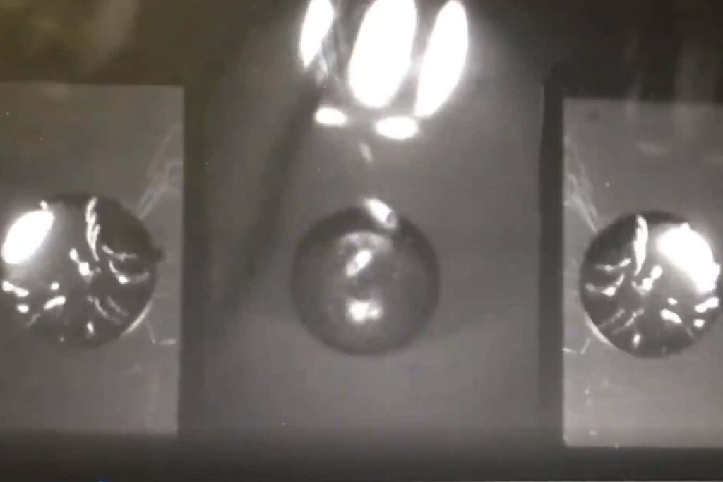 Extremely cold drop of helium can be levitated forever